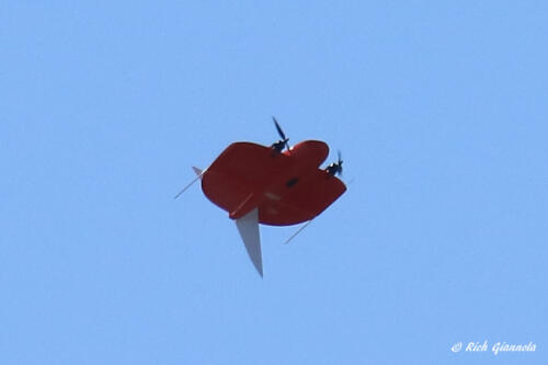 A drone flying near the parking lot