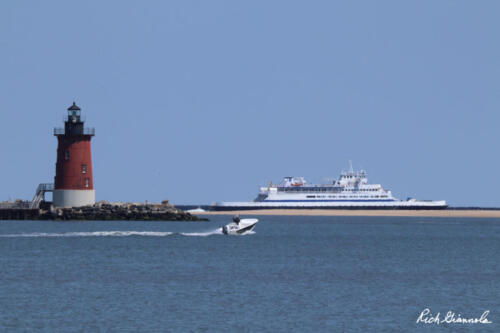 Cape May-Lewes Ferry passing the Delaware Breakwater East End Lighthouse as it departs from Lewes